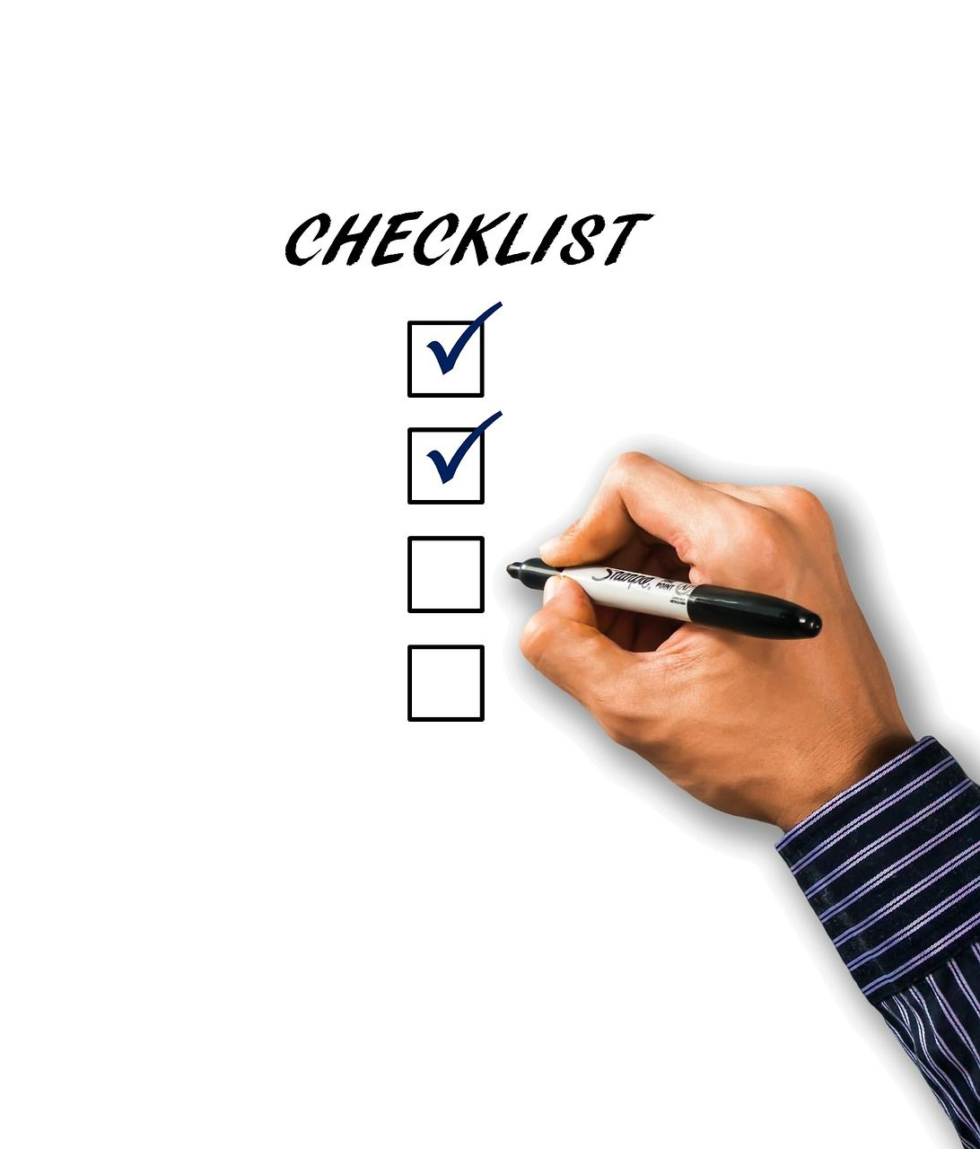 Image of a hand ticking a checklist